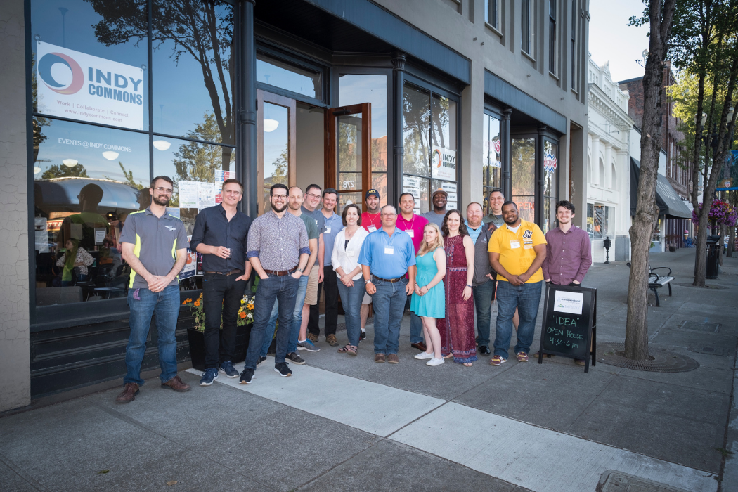group of people standing outside a coworking space