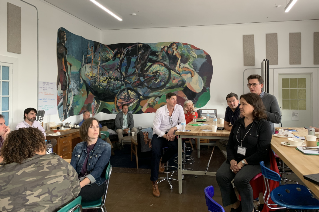 Group of people in a room speaking
