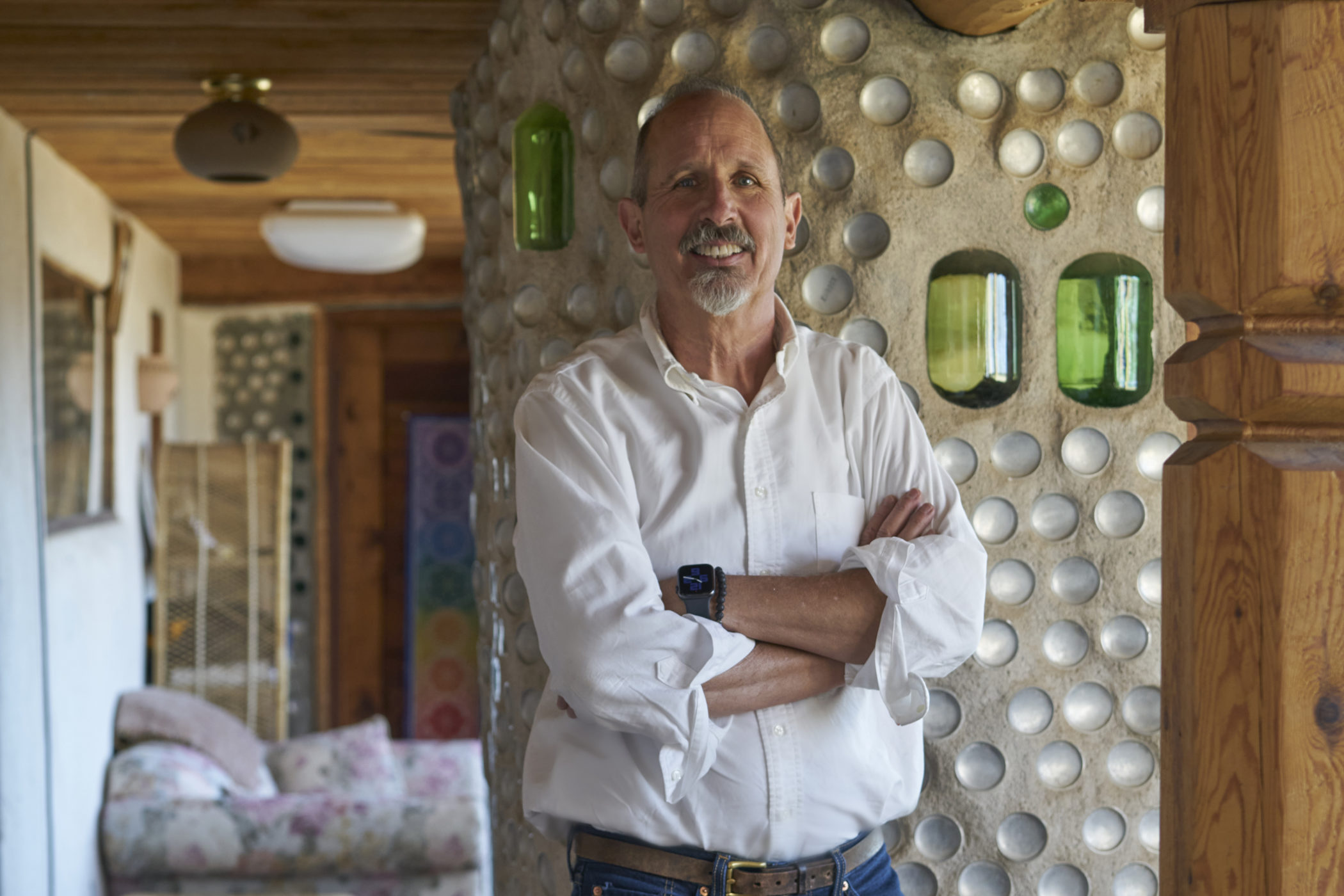 Marko Schmitt photographed inside his earthship home