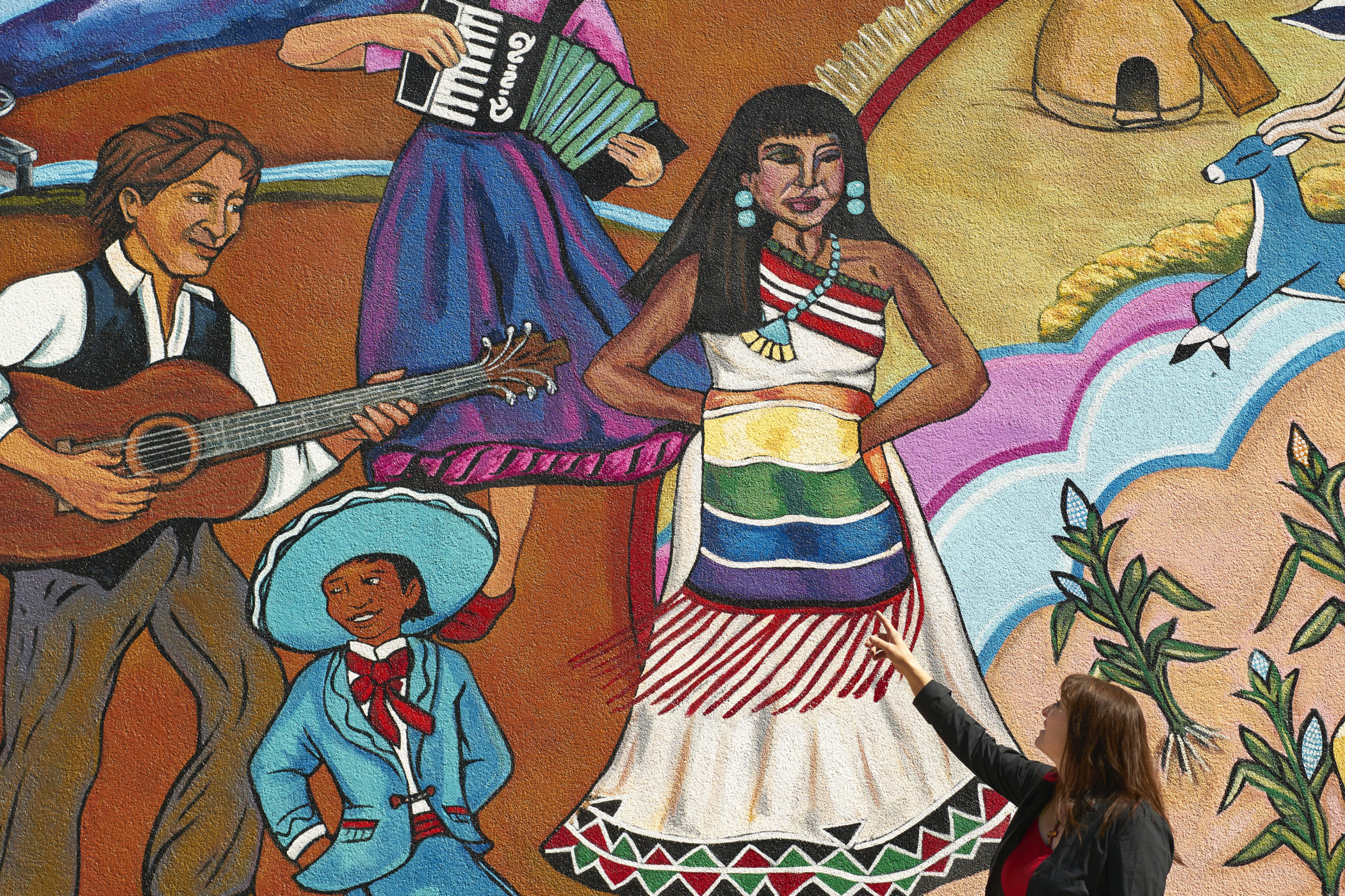 Nikki Maes talks about a mural in Taos