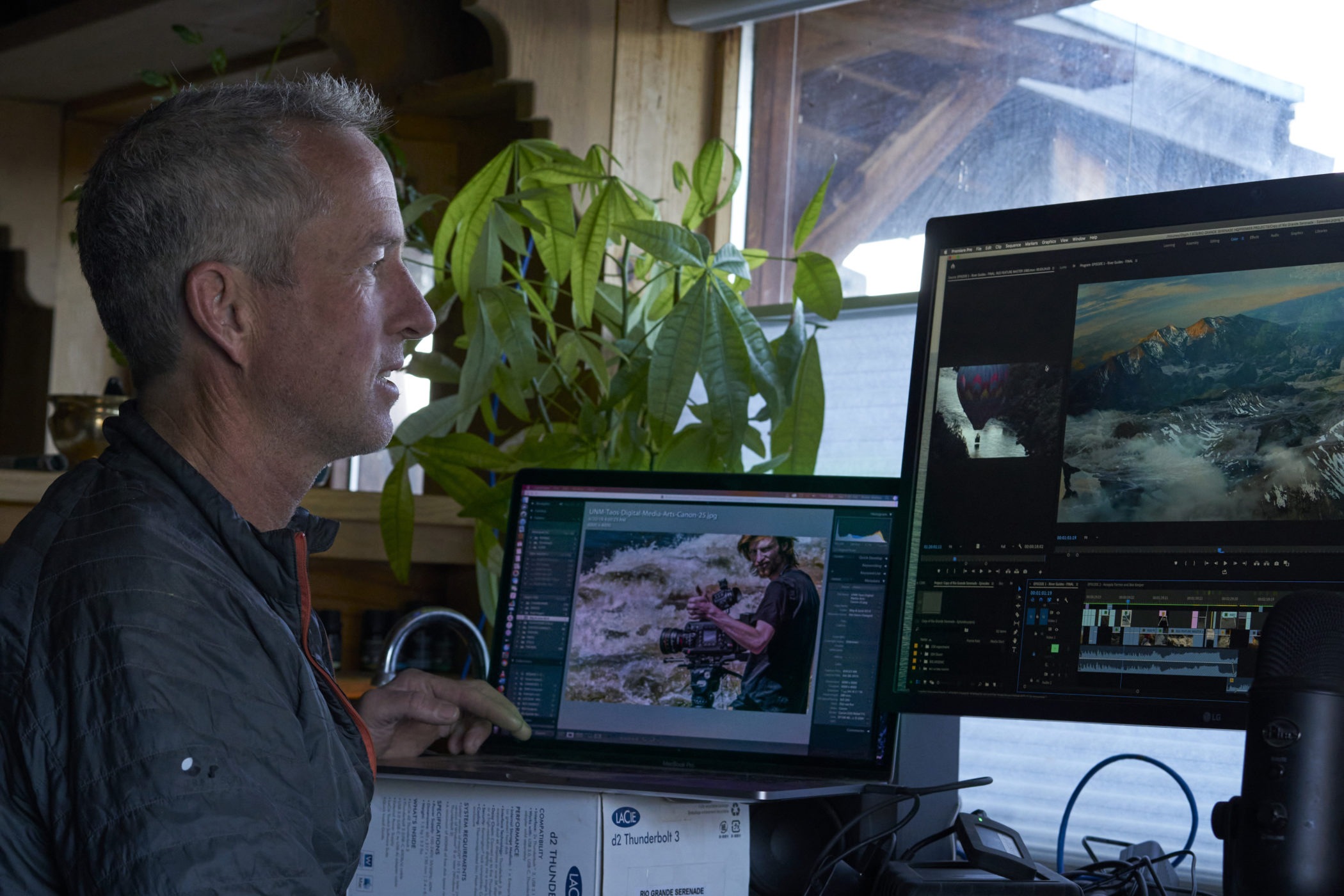 Peter Walker edits a film at his desk.