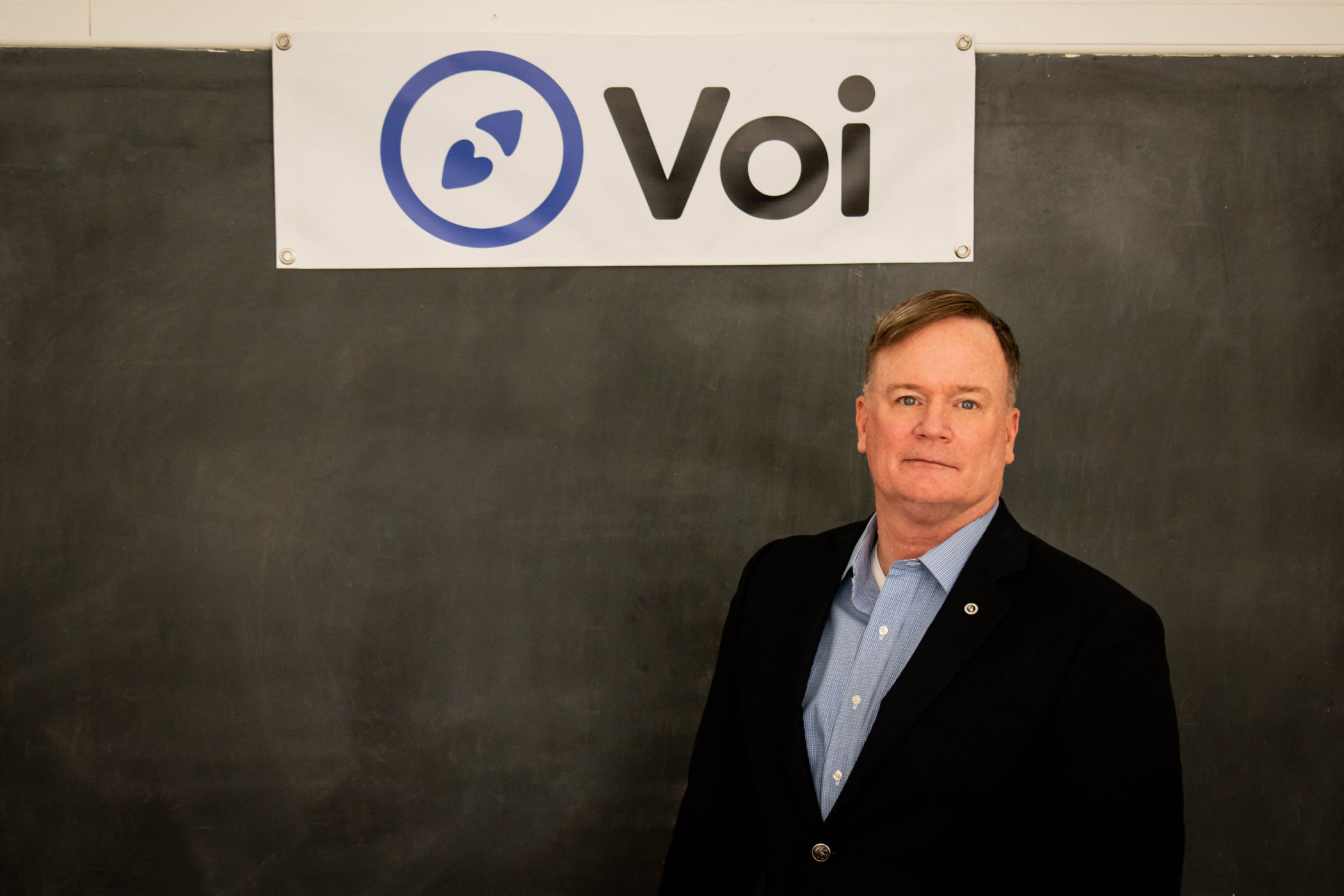Rick Johnson stands in front of a chalkboard