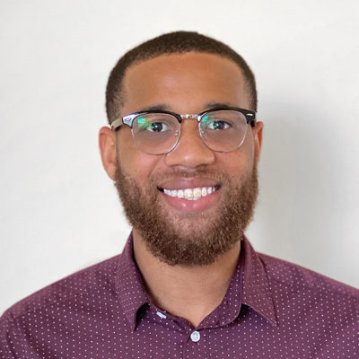 Justin Cooks headshot in front of a white background