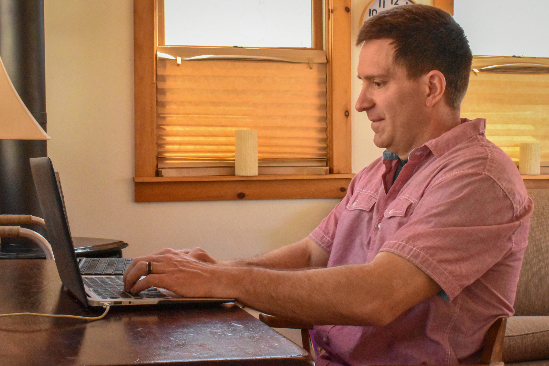 TJ Whipple types at his desk