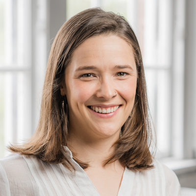 Nora Foote headshot in front of a window