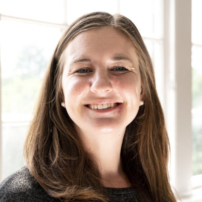 Kaitlin Klaustermeier headshot in front of a bright window