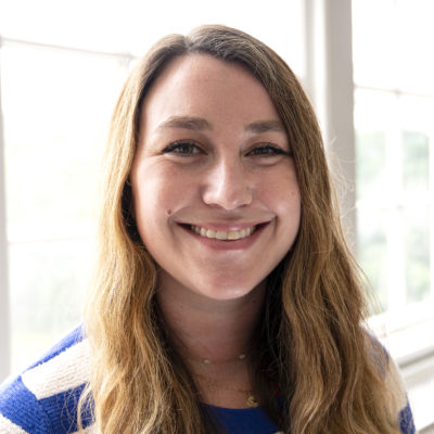 Molly Pyle headshot in front of a bright window