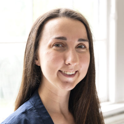 Rachel Barra headshot in front of a bright window