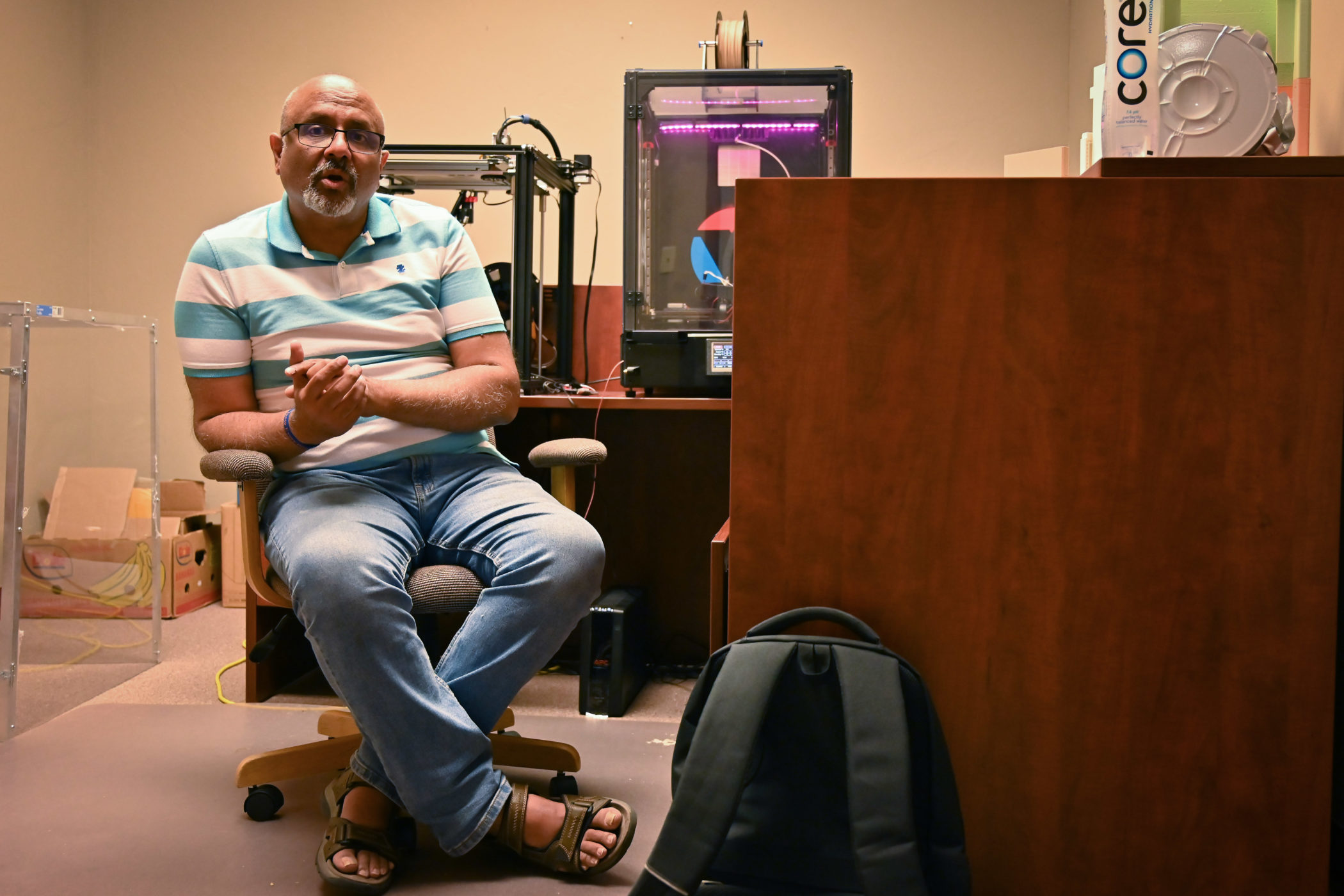 Naresh Juneja talks in his office