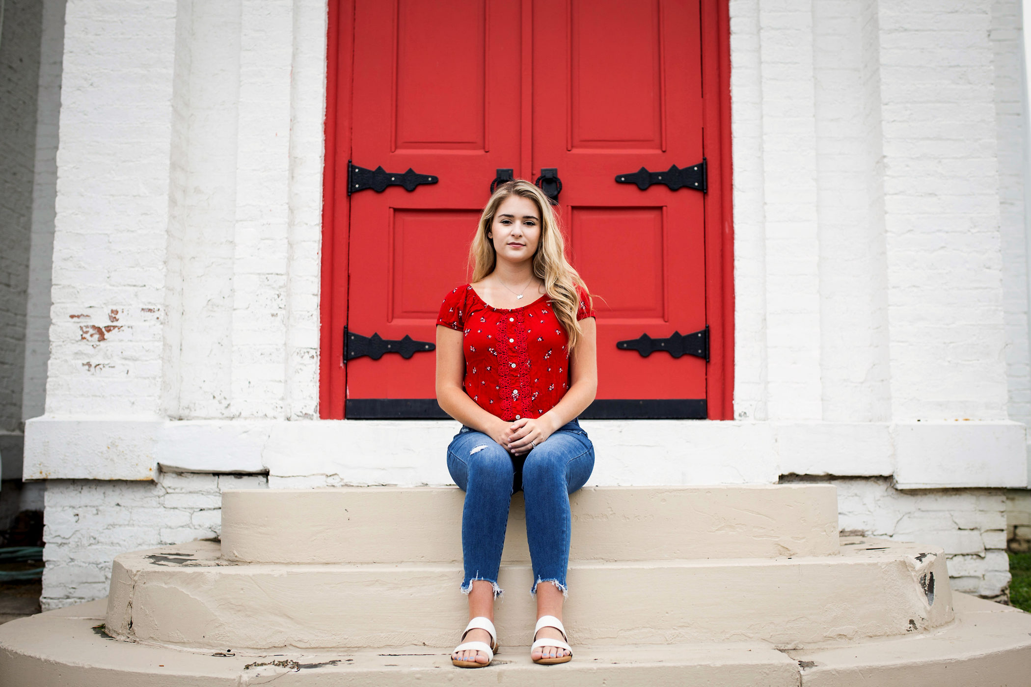 Audrey Schiesser sitting on the steps of her church