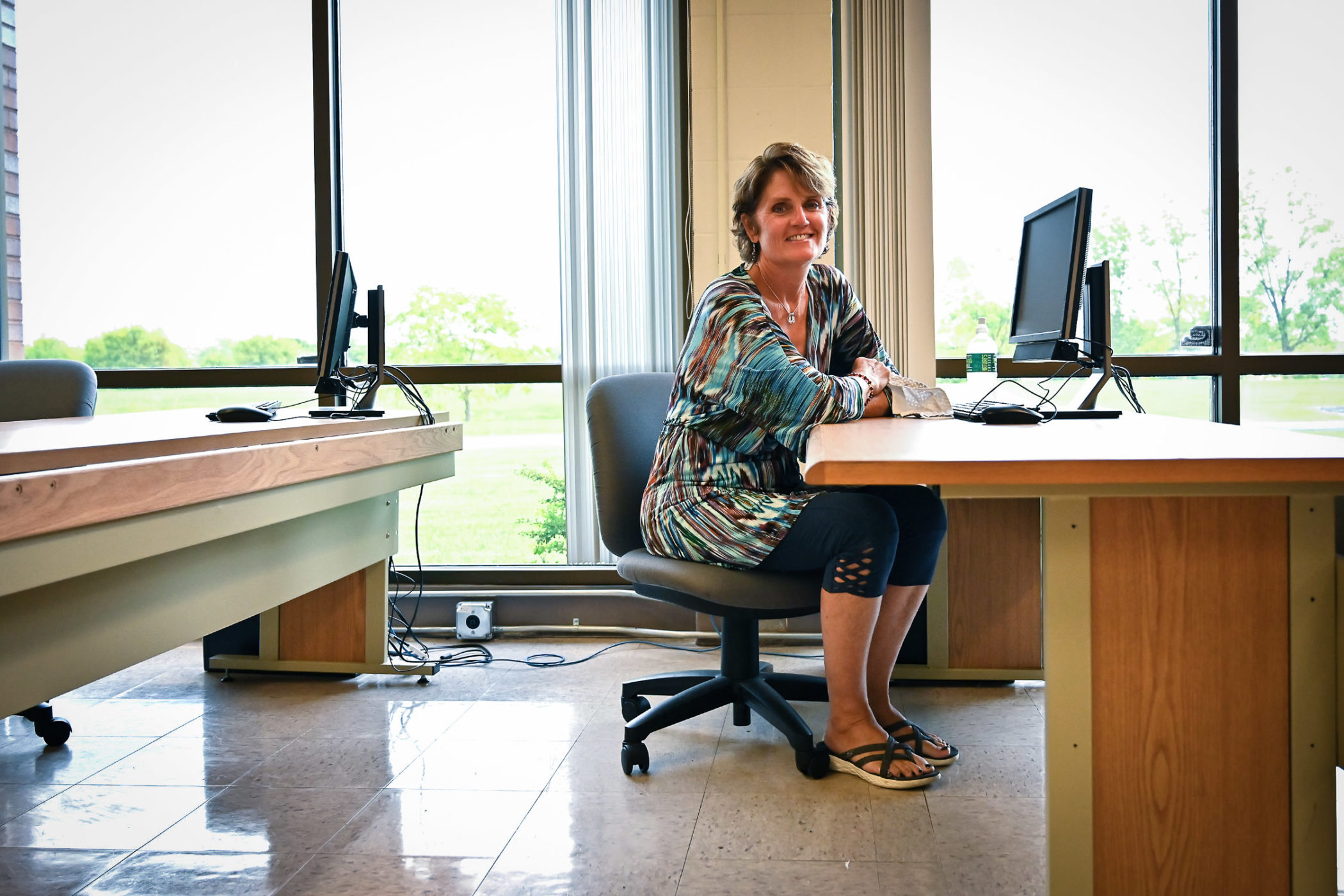 Katie Hardyman seated at a desk in a classrom
