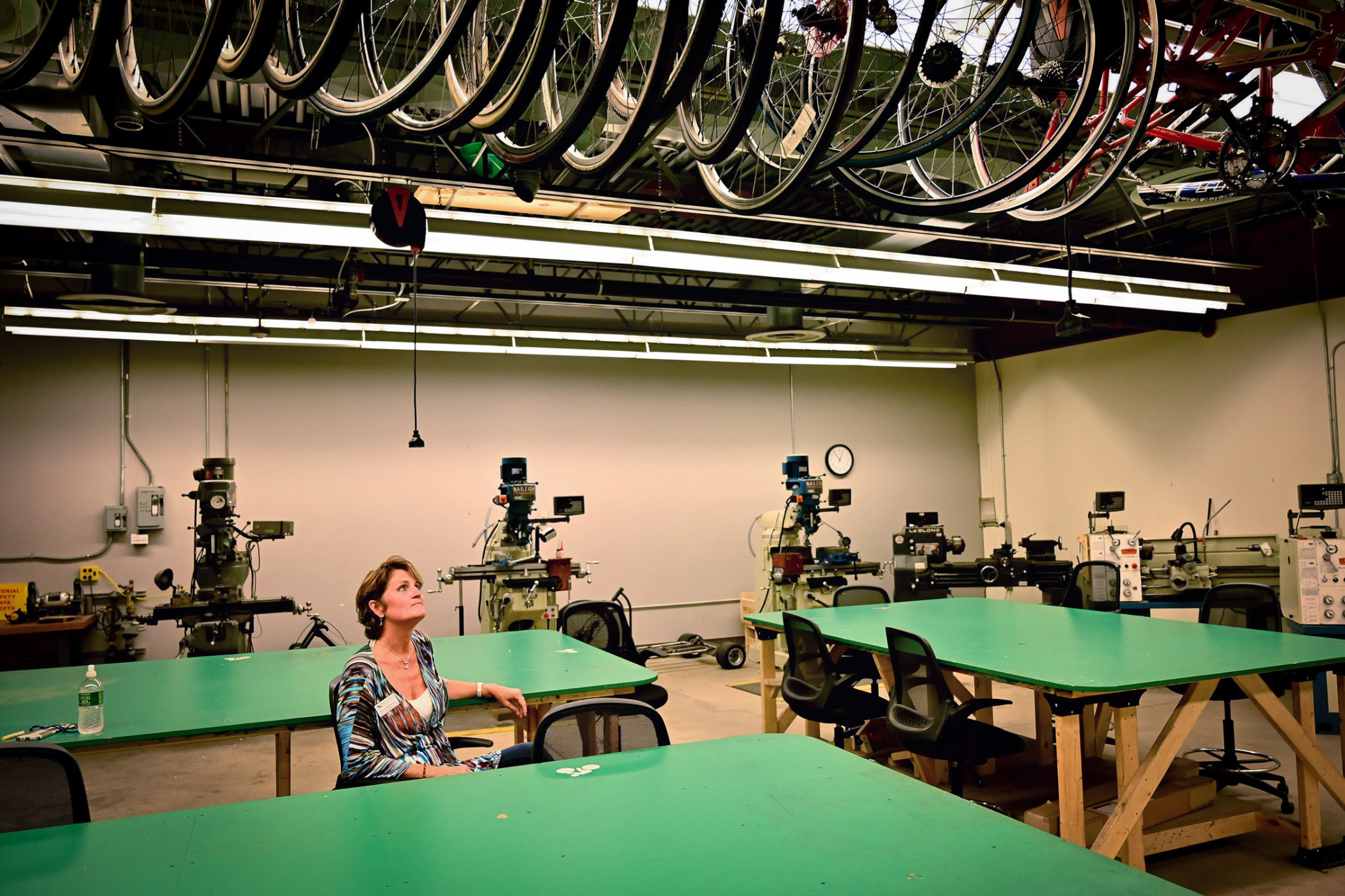 Katie Hardyman looks up at bikes on a ceiling rack